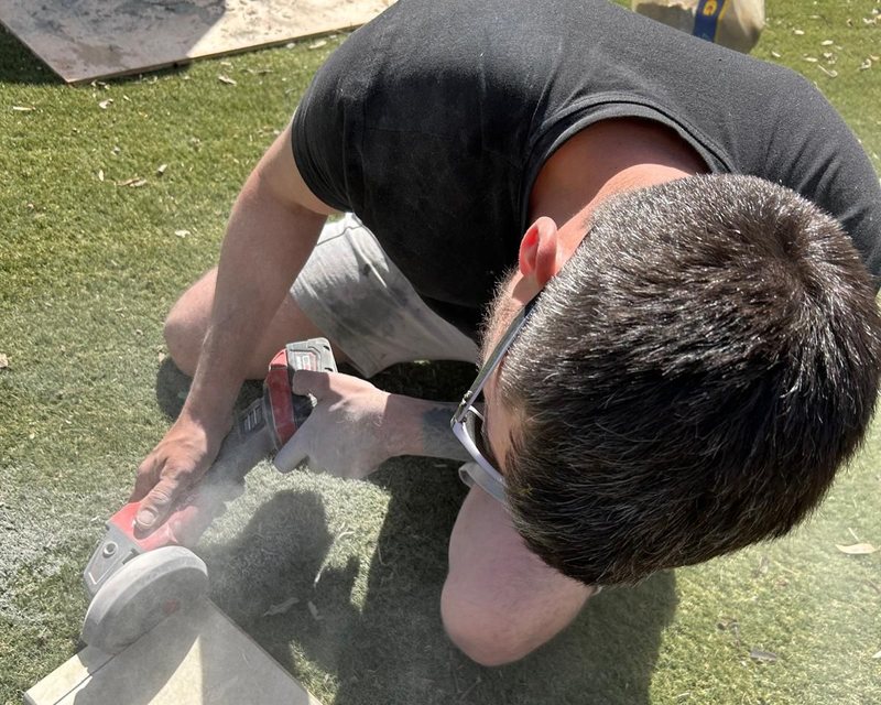 Precision cutting paving slabs on site by White&Son
